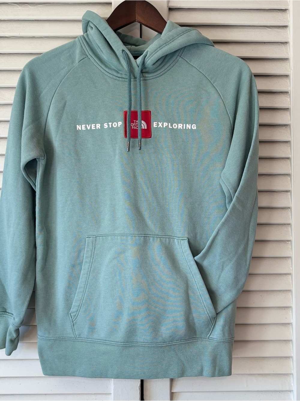 The North Face Light Teal Pullover Hoodie with Red Logo